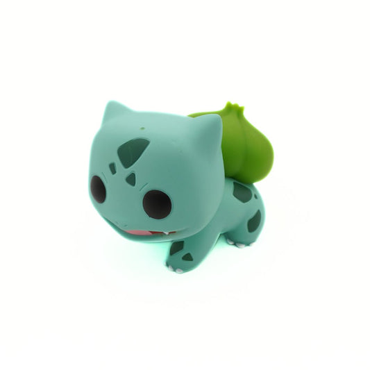 Green cartoon character with a leaf on a white background