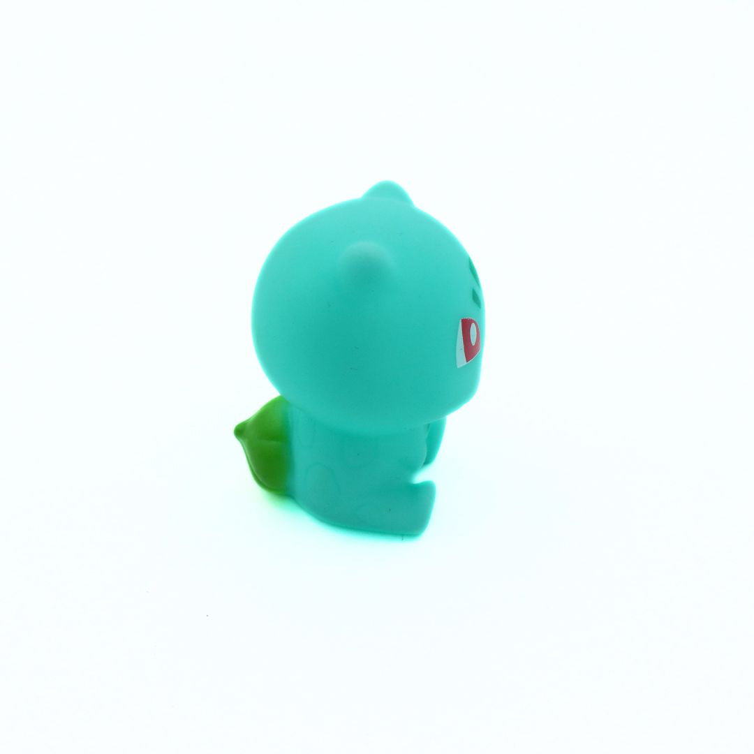 Green rubber duck with a red logo on a white background
