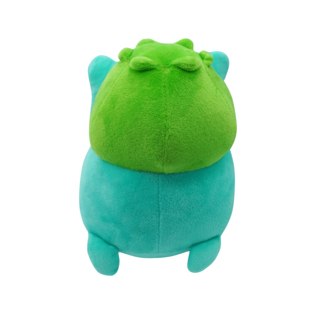 Green and blue plush toy on a white background