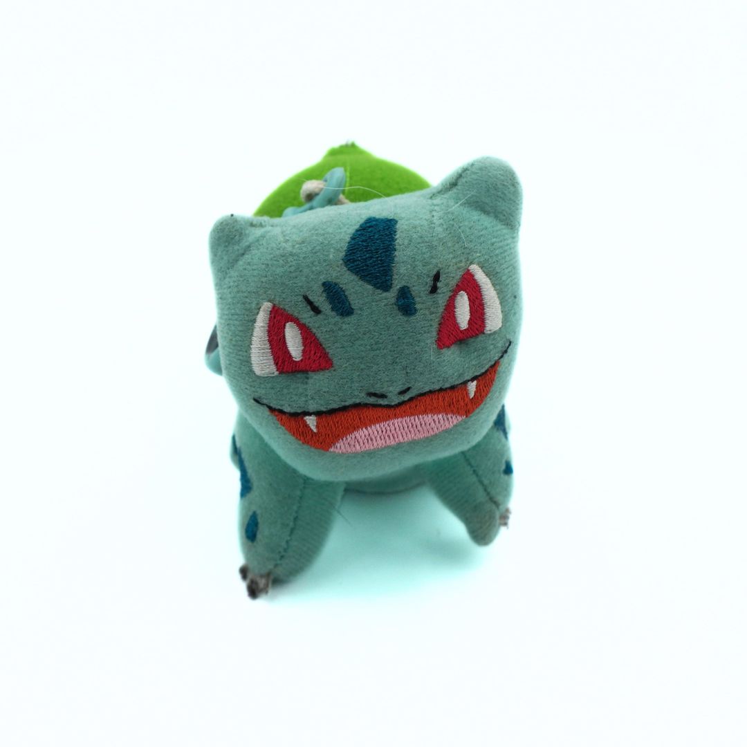 Plush toy of a character with a green background