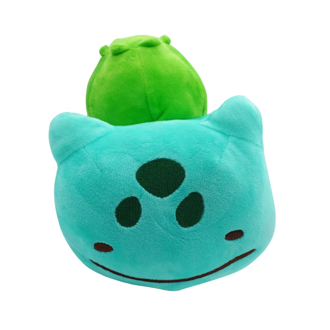 Plush toy with a green top and blue body on a white background