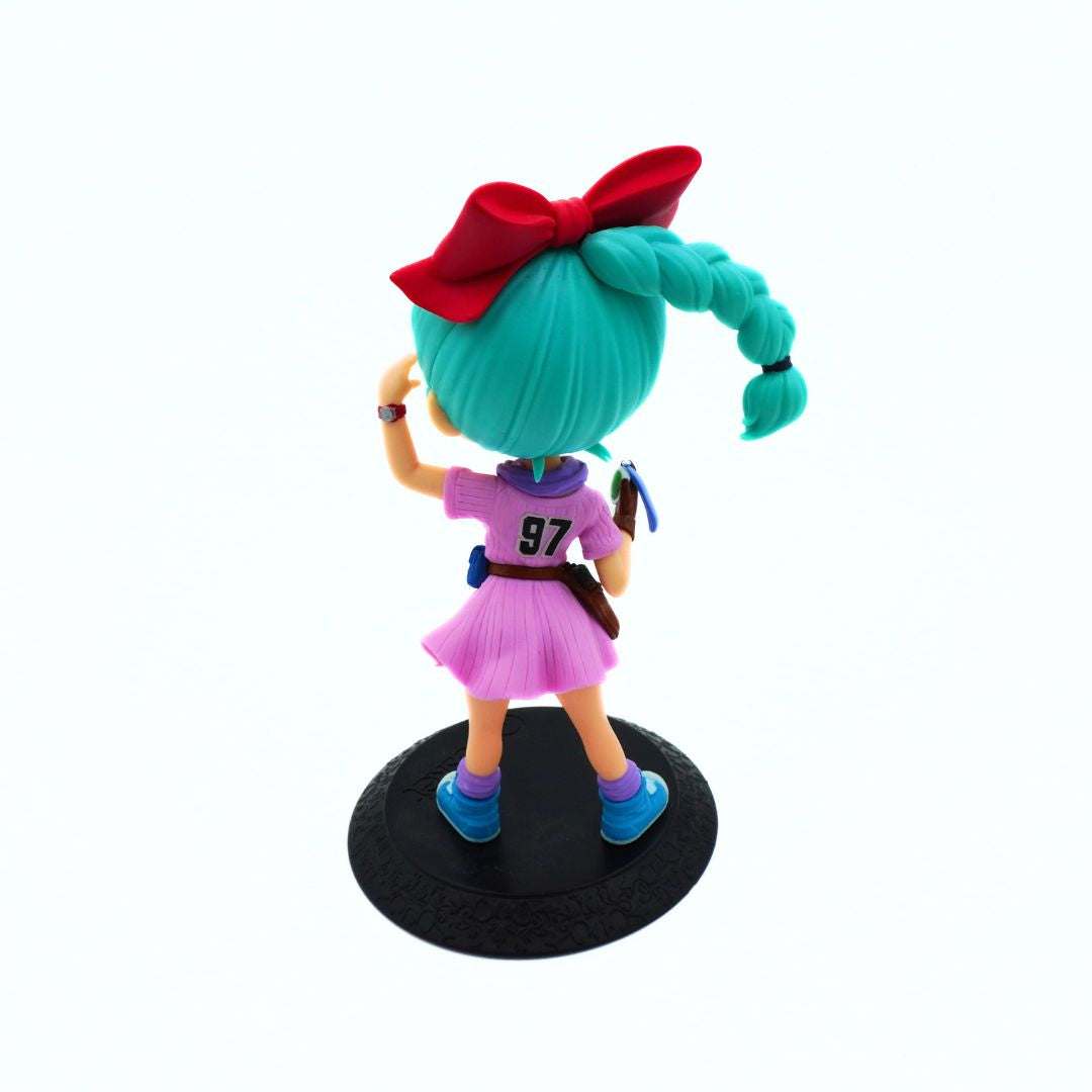 A stylized anime figurine of a character seen from the back, with bright teal hair in a ponytail, a large red bow, a pink dress with the number 97 on the back, blue shoes, and a black circular base, photographed on a plain white background.