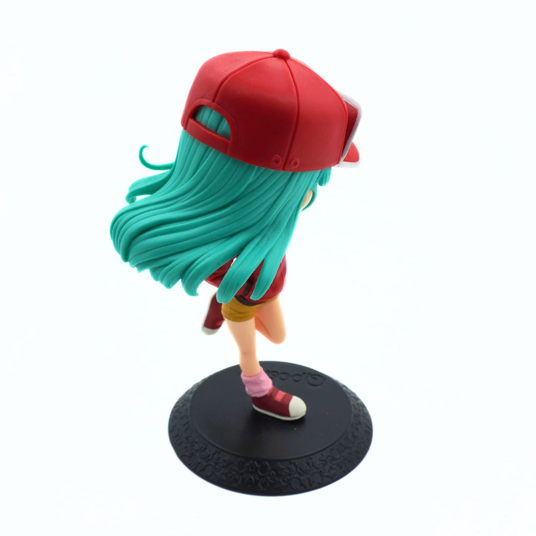 A stylized anime figurine of a character with long turquoise hair, wearing a red cap, red outfit, pink socks, and red-and-white sneakers, standing on a round black display base against a plain white background.