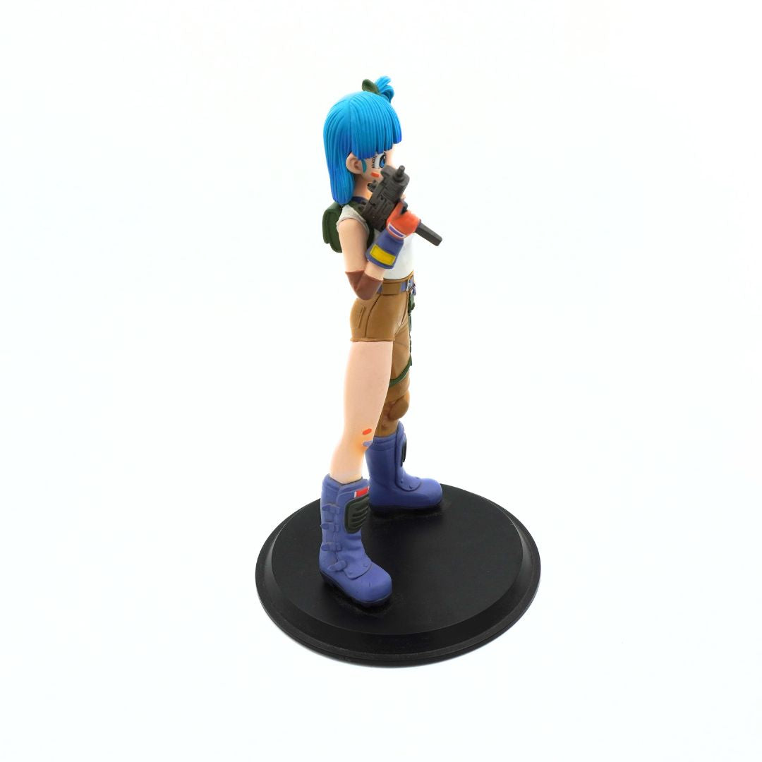 A collectible anime figurine of a female character with bright blue hair, wearing a brown outfit and blue boots, holding a gun, standing on a round black base against a white background.