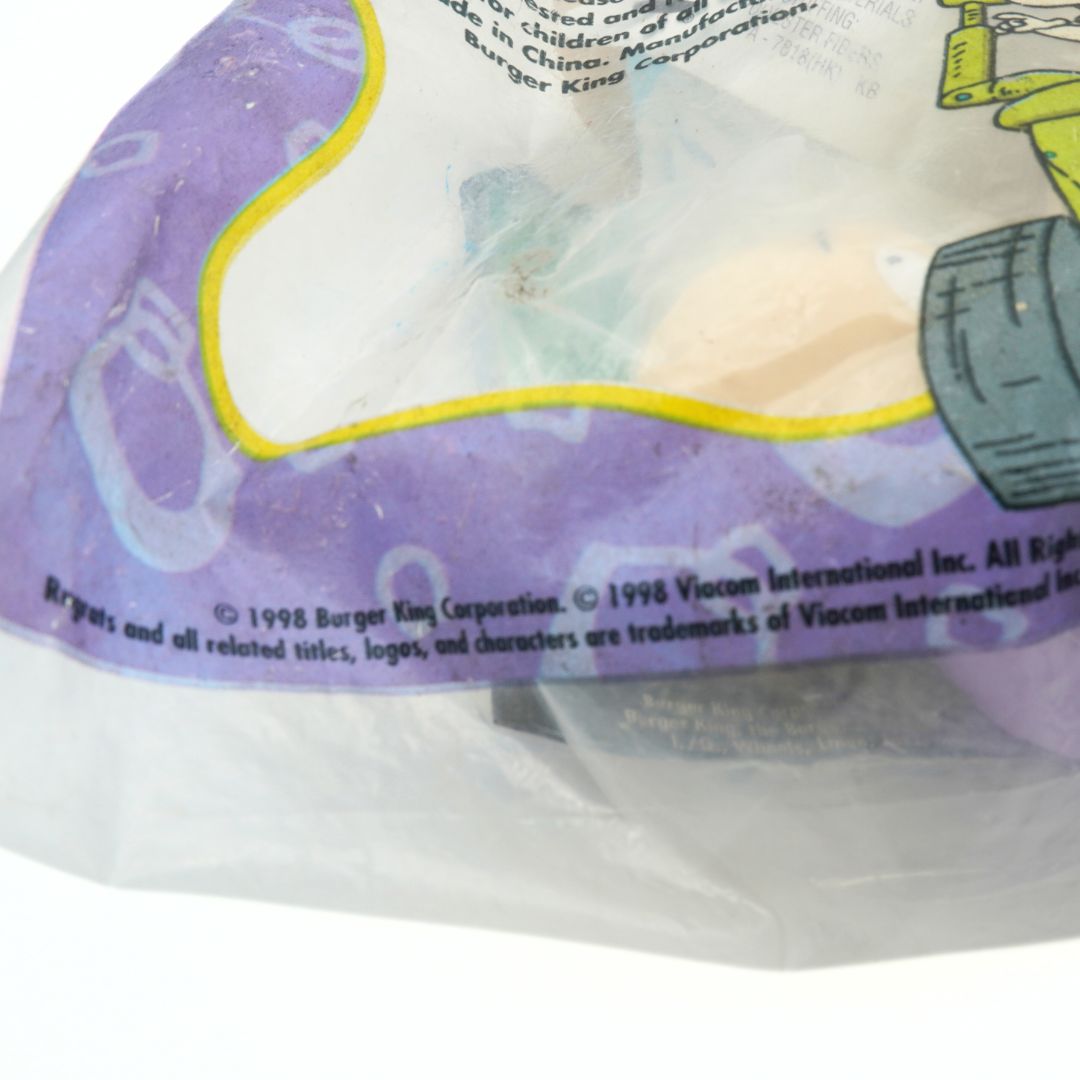 Closeup of the copyright and branding information on a vintage 1998 Burger King Rugrats toy