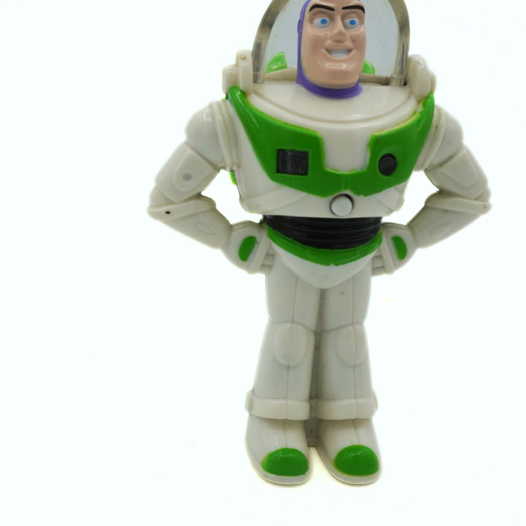 Toy figure of Buzz Lightyear from Toy Story on a white background