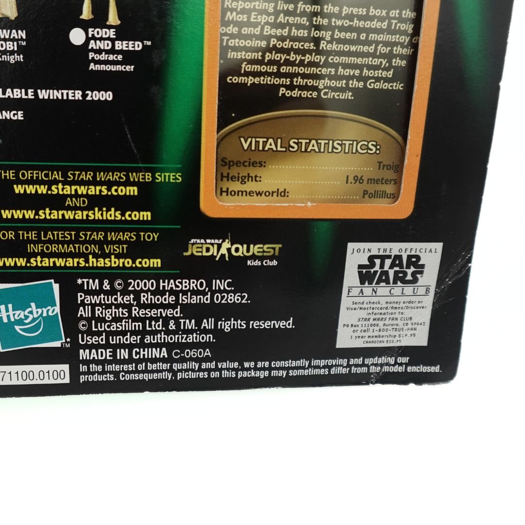 Close up of the branding and copyright information on the Fode and Beed cardback, showing creasing in the bottom right corner