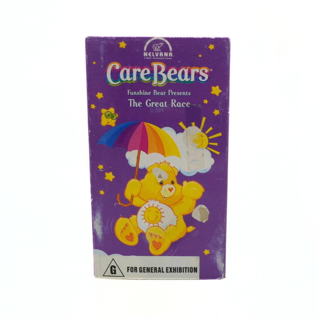 VHS tape cover of 'Care Bears: The Great Race' with a purple background and Care Bear illustration.