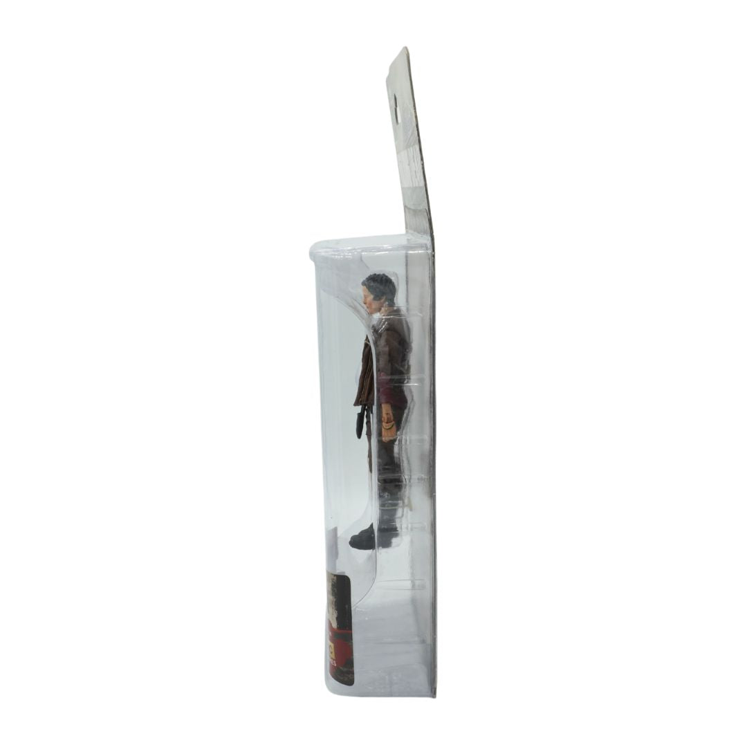 Action figure in a clear packaging box on a white background