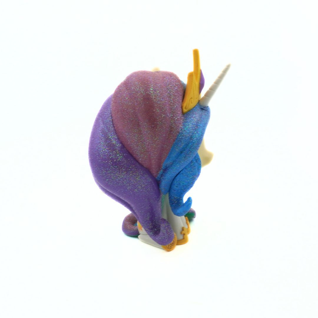 Plush toy with purple and blue colors on a white background