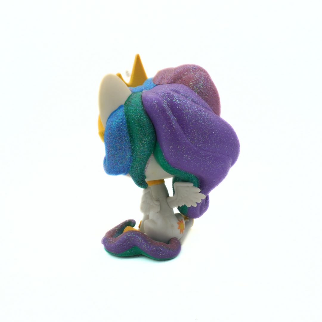 Colorful toy figure with a purple hat and yellow crown on a white background