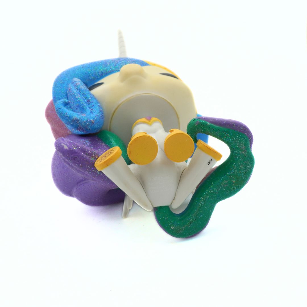Toy figure with colorful spiral design on a white background