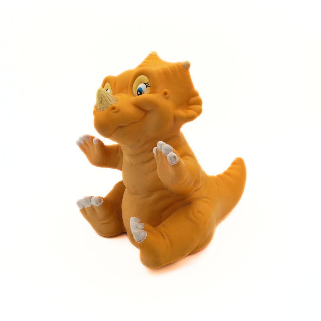 Rubber dinosaur toy on a white background