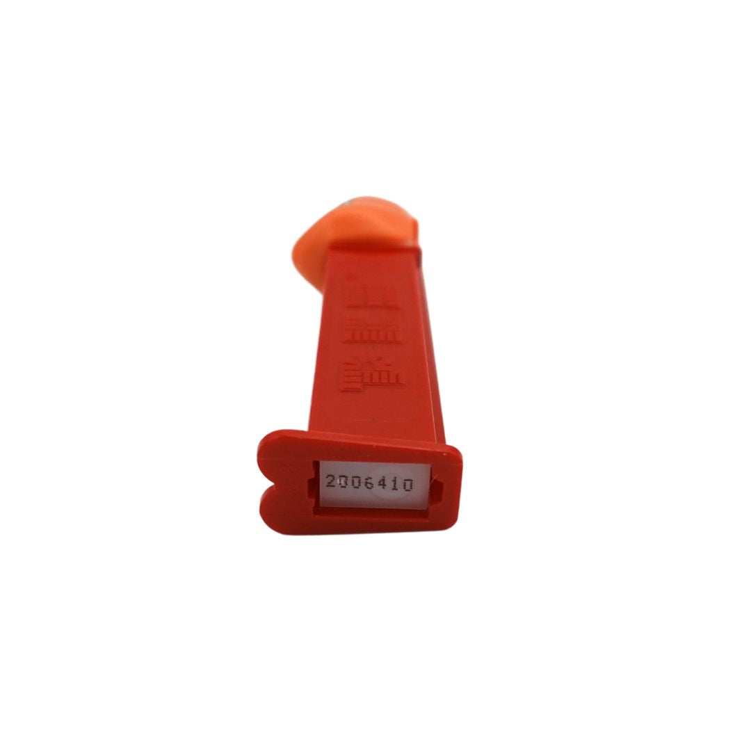 Underside of a Charmander Pez dispenser with a red body and an orange head, stamped with the number 2006410