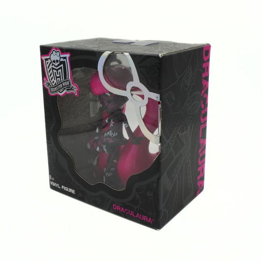 Boxed vinyl figure of a character with pink hair, featuring the brand 'Monster High' on a white background.