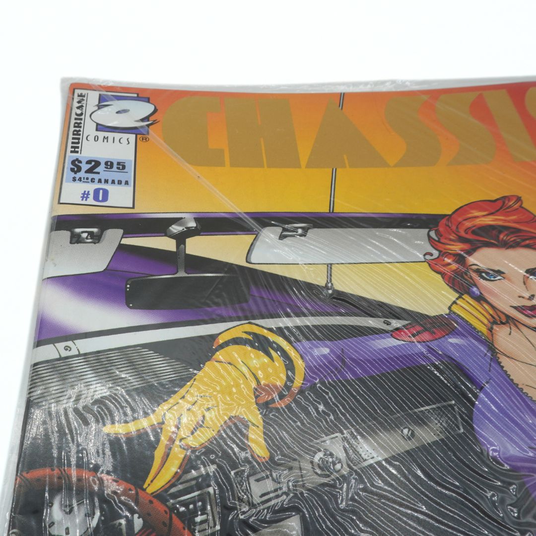 Comic book cover with a car and woman's face design, featuring Hurricane Comics branding.