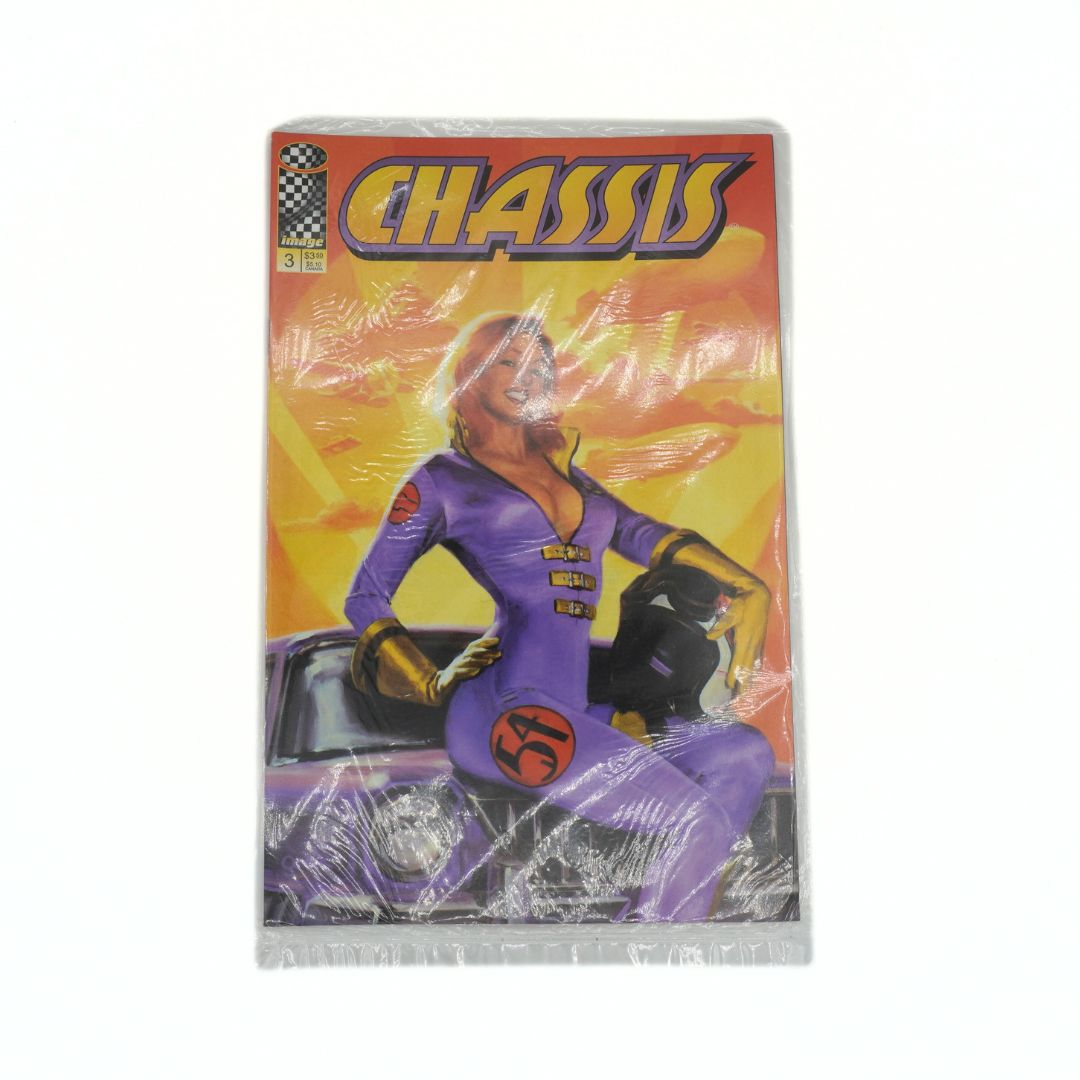 Comic book titled 'Chassis' with a character in a purple suit on the cover, wrapped in plastic.