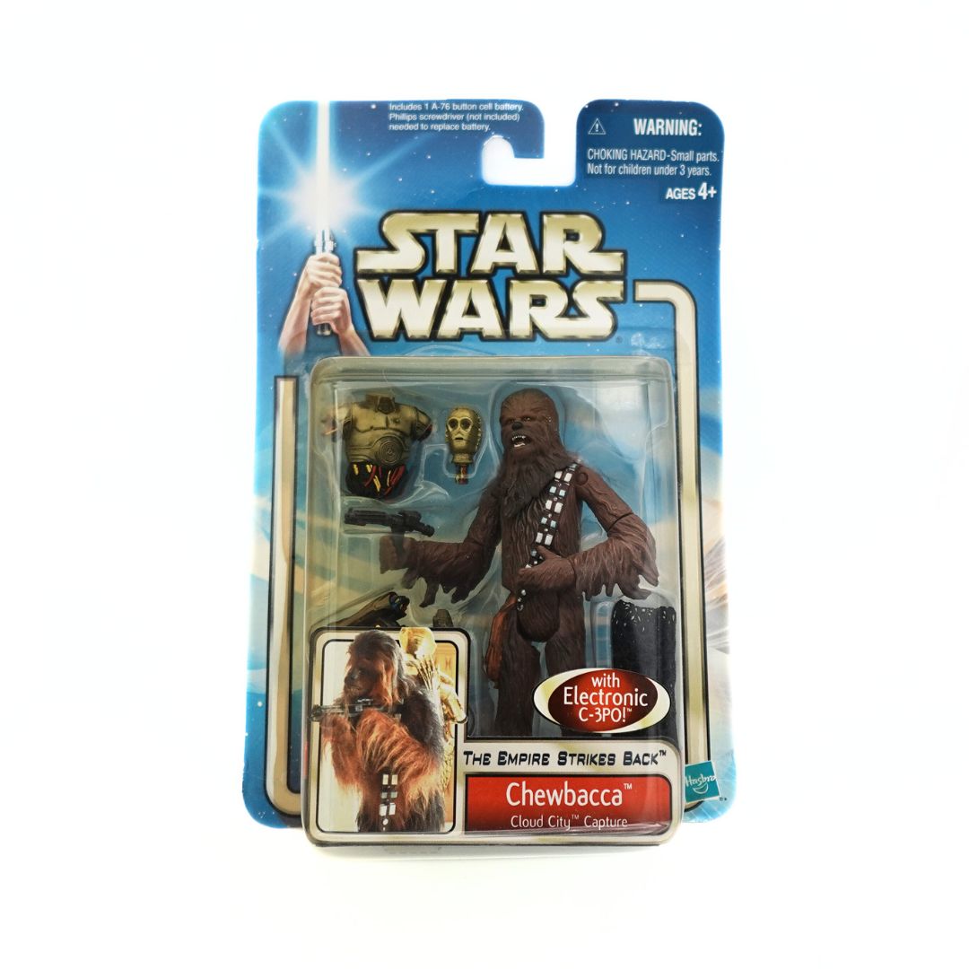 Front on photo of the 2002 Hasbro Cloud City Capture Chewbacca figure with C3P0 pieces and netting accessories