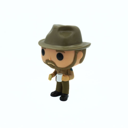 Figurine of a character wearing a hat and uniform on a white background