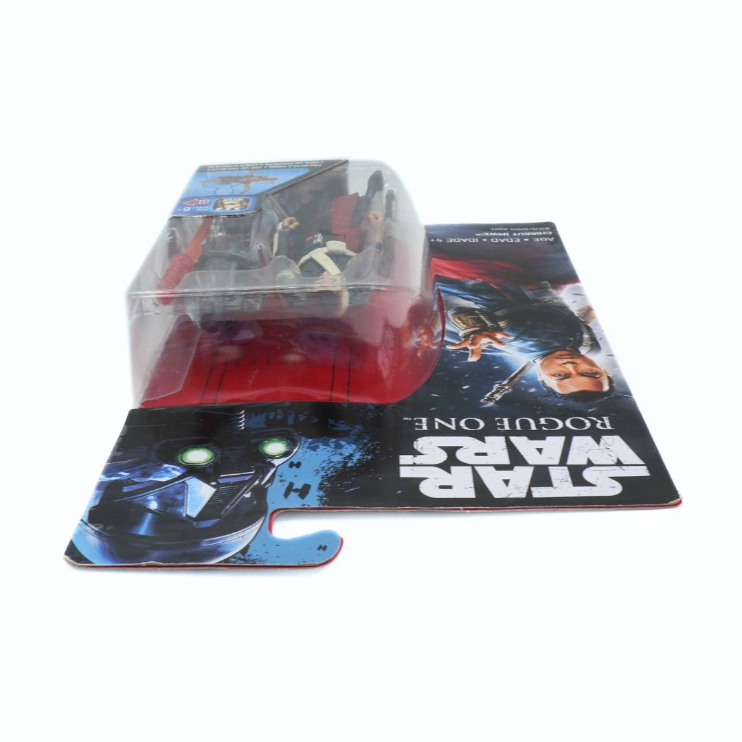 Star Wars Rogue One action figure in packaging on a promotional poster