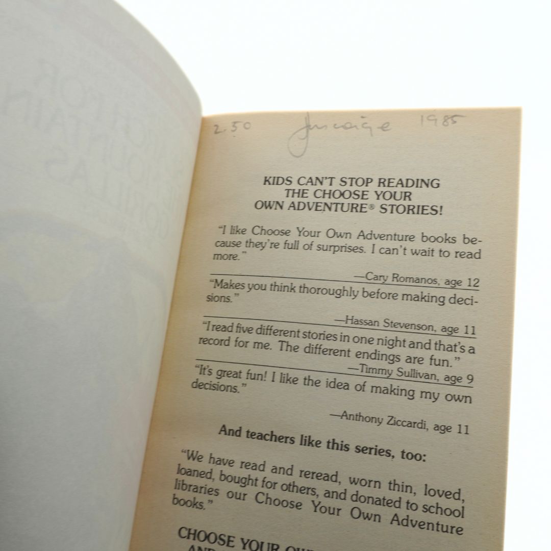 Open book with text about Choose Your Own Adventure books, featuring signatures and endorsements.