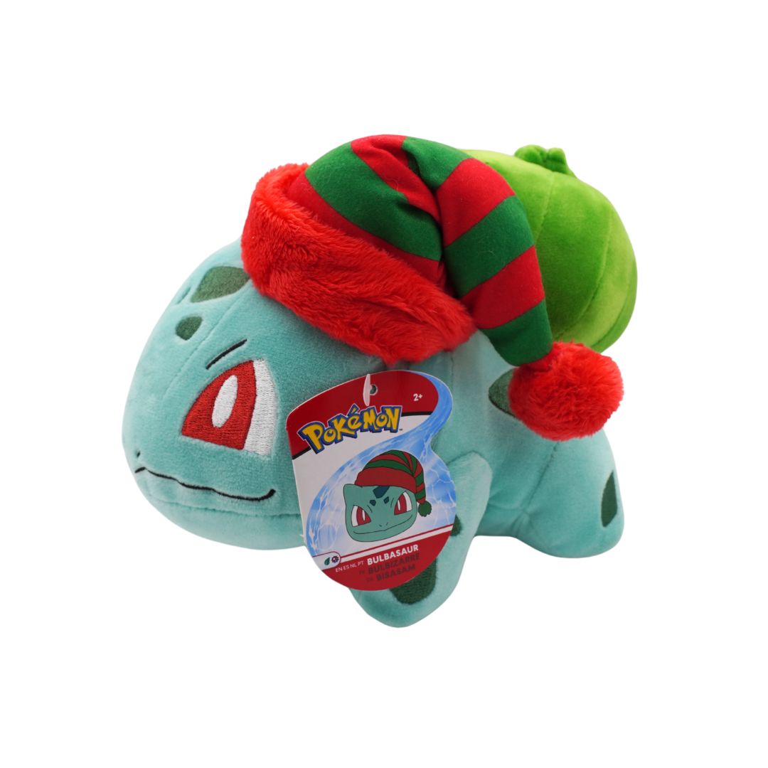 Plush toy of a Pokémon character with a red and green hat on a white background