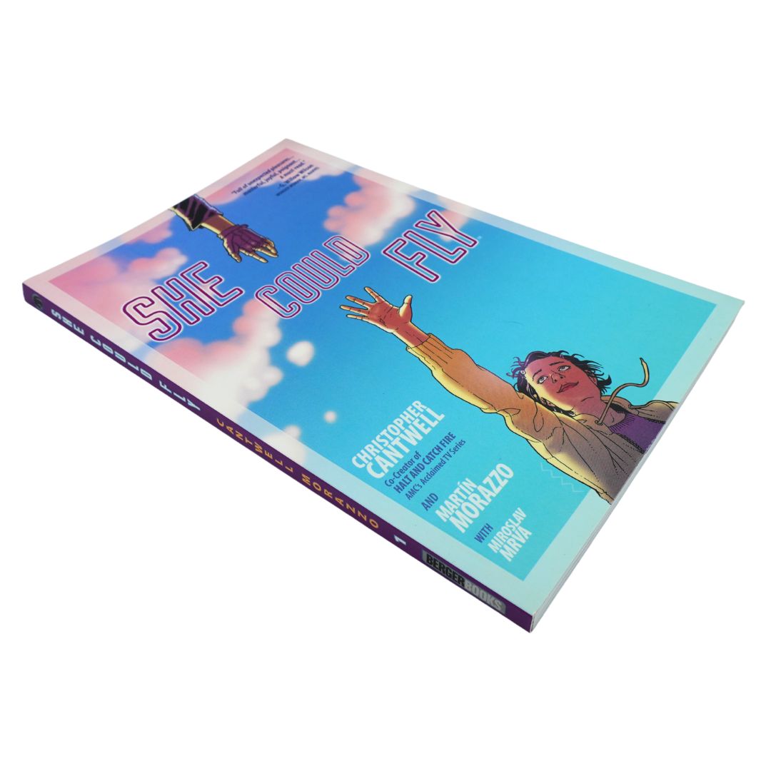 A comic book titled 'She Could Fly' by Christopher Cantwell, featuring a colorful cover illustration of a woman reaching upward against a blue sky with clouds.