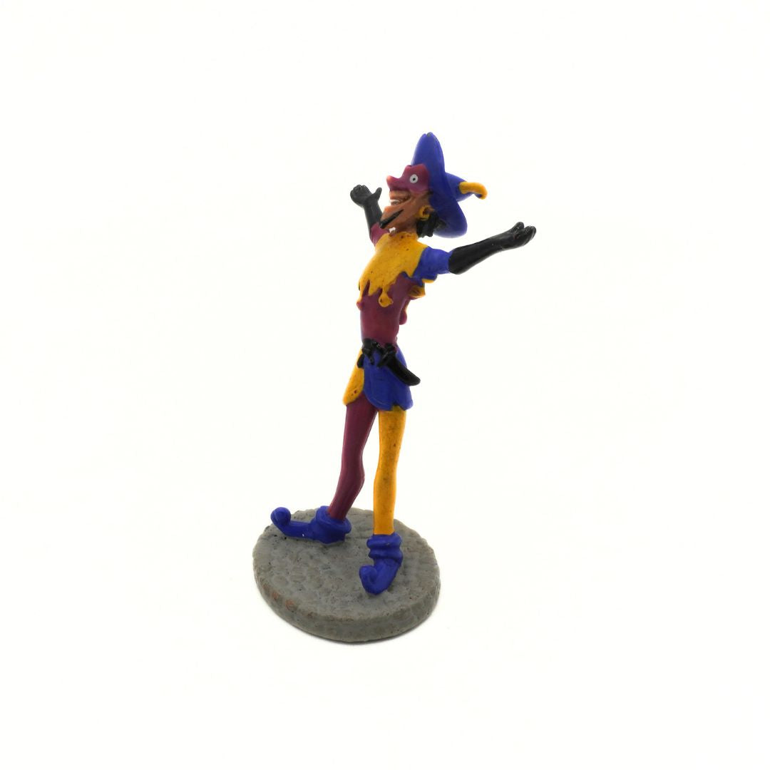 Colorful figurine of a character in a blue outfit with a white background