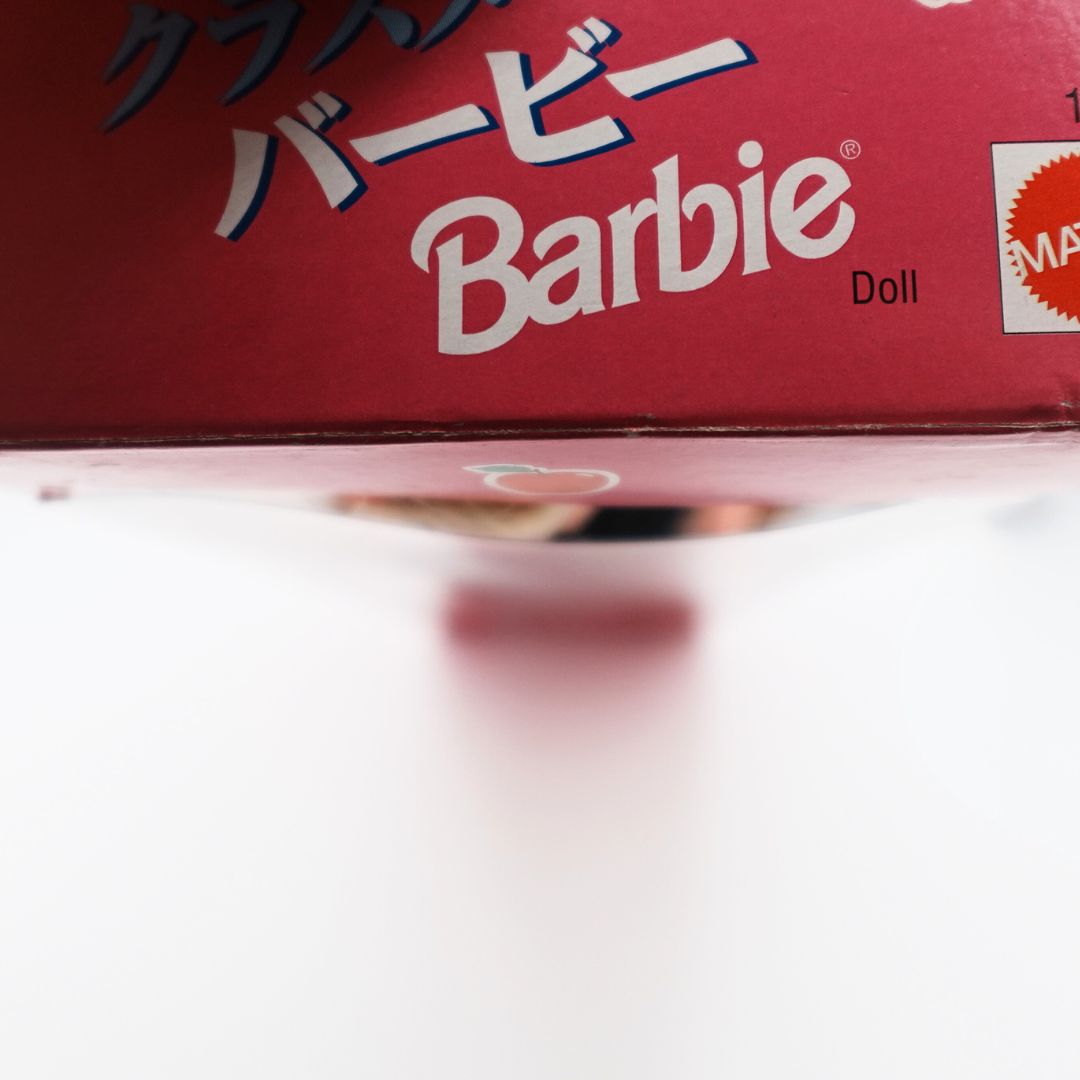 Close up of top of the Classmate Barbie doll box, with plastic opening damage