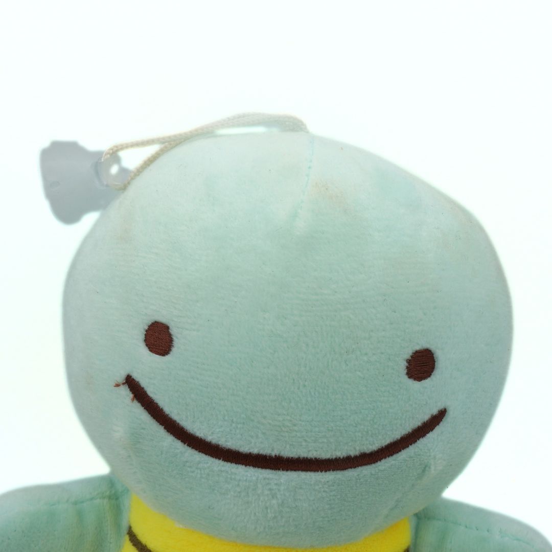 Plush Pokemon toy with a light blue face and yellow shell on a white background