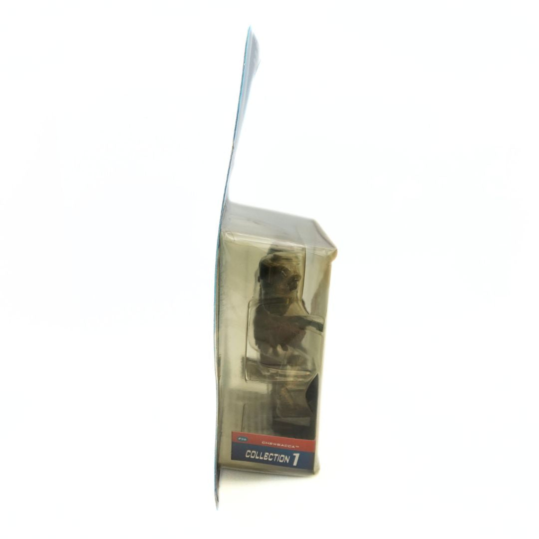 Side on photo of the Chewbacca Cloud City Capture packaging showing a yellowing plastic bubble