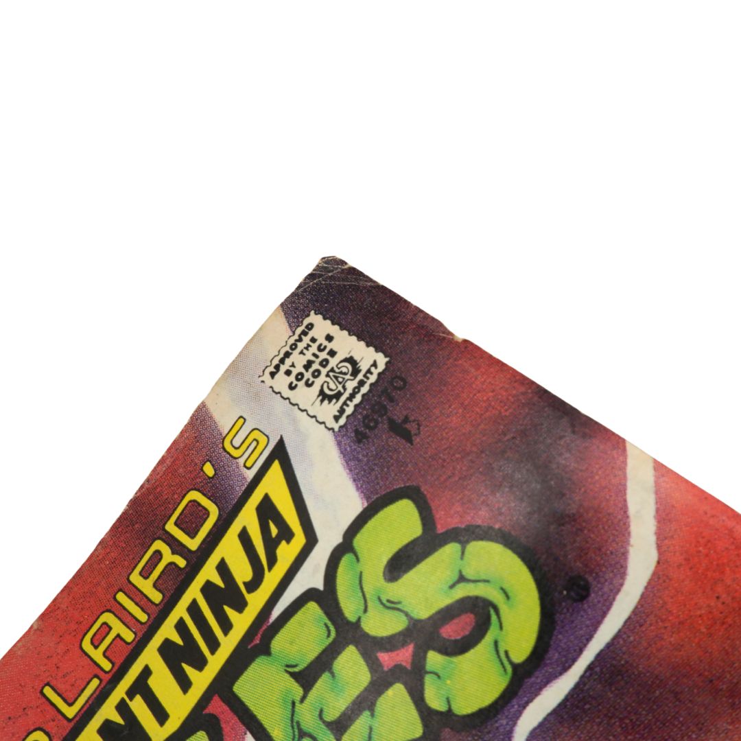Close-up of a product packaging with colorful text and graphics on a white background