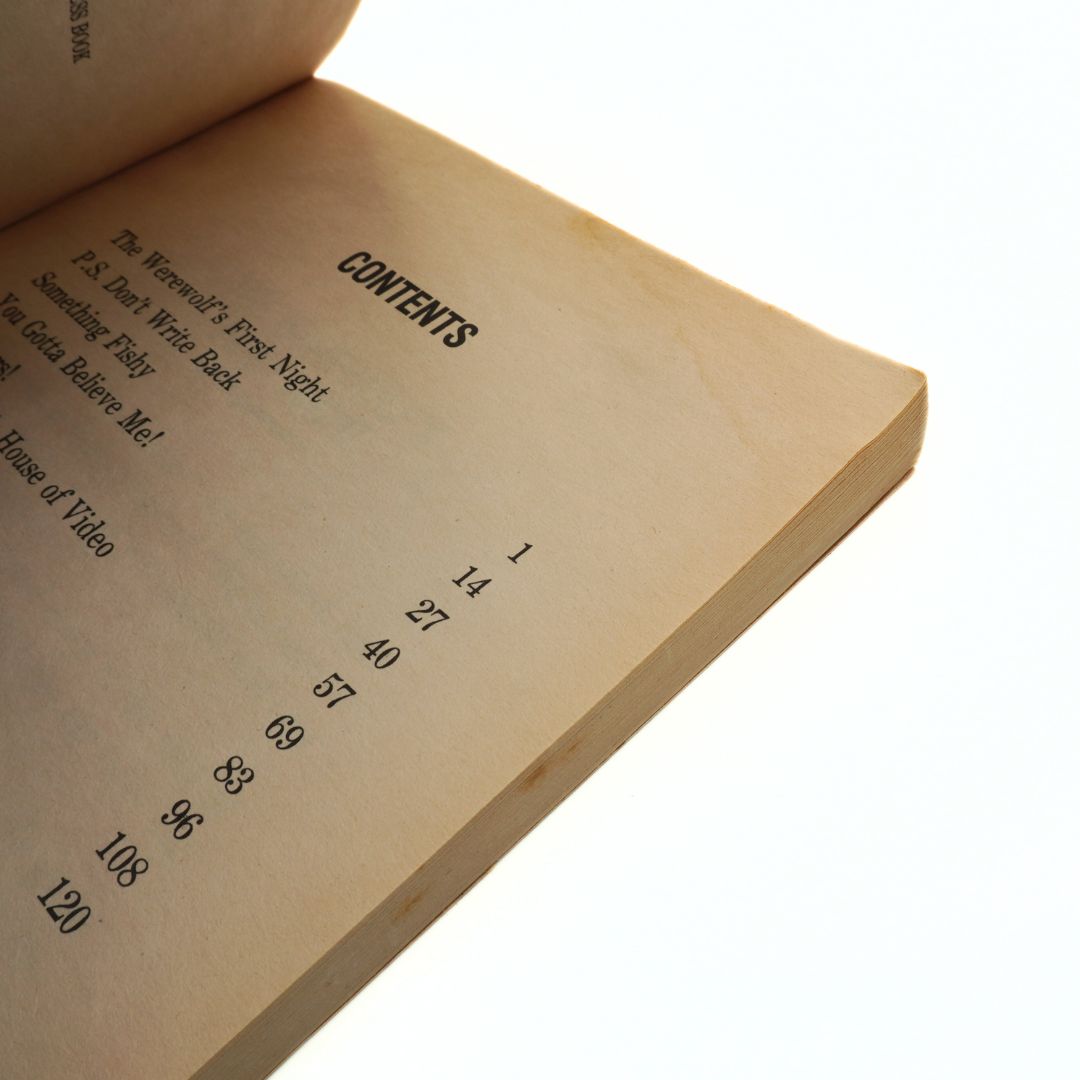 Open book showing a table of contents on a white background