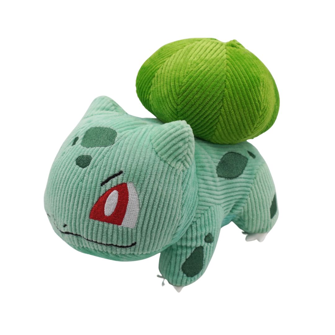 Green plush toy resembling a character from a popular franchise on a white background