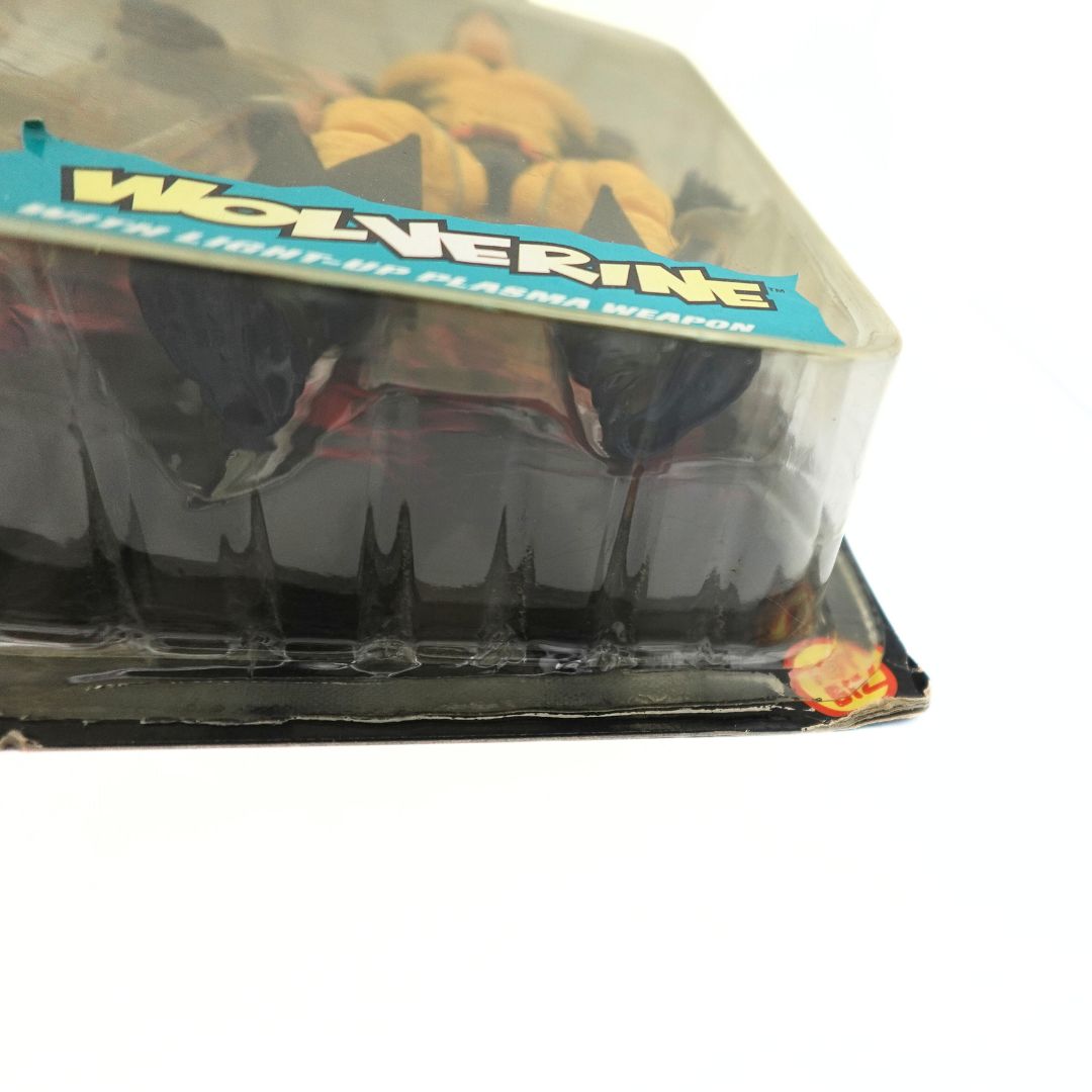 Corner wear to the packaging on a 90s Wolverine toy