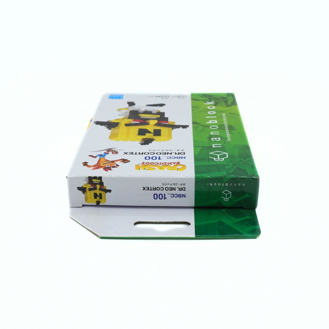 A box of NBCCC 100 DR. NEO COMPLEX 140-piece building blocks featuring a white and green design with block illustrations.