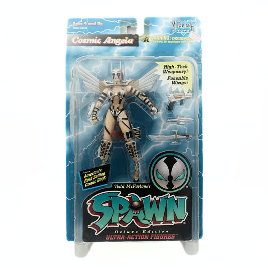 Cosmic Angela action figure from Spawn, wearing a black, silver and gold outfit inside its packaging