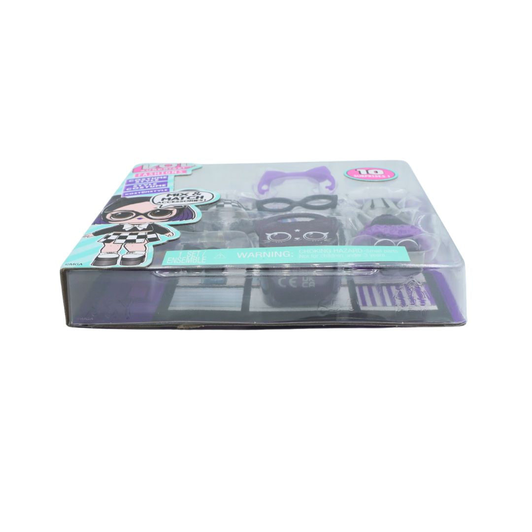 A boxed toy set in clear plastic packaging on a plain white background. The package contains a black-and-white checkered doll figure and several small accessories in purple, black, and teal.