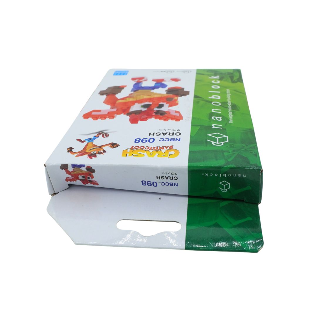 A boxed toy product shown on a plain white background. The package is mostly white on the left with colorful cartoon graphics and a green panel on the right.