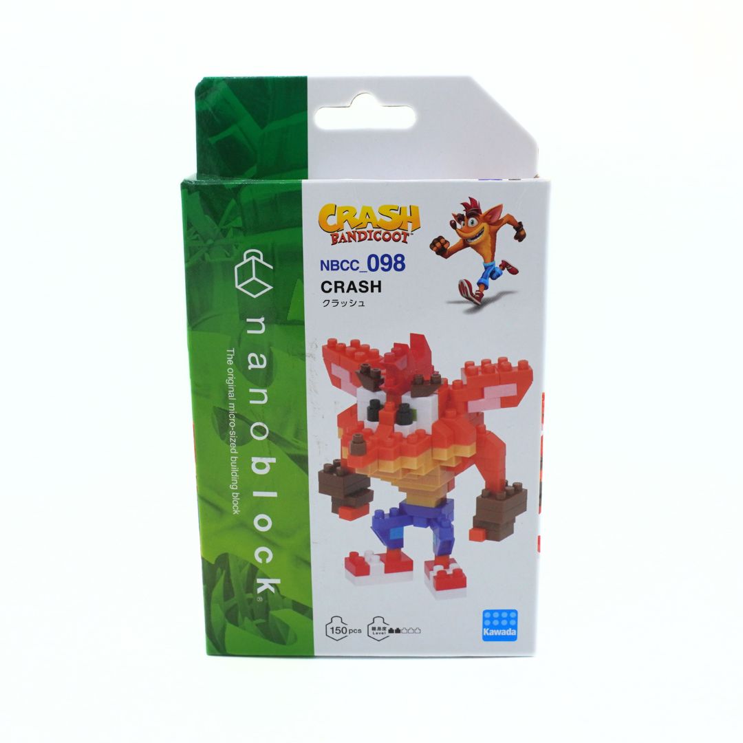 Crash Bandicoot nanoblocks toy packaging, model NBCC.098, featuring a green and white box with an illustration of the assembled red, orange, and blue block-built toy.