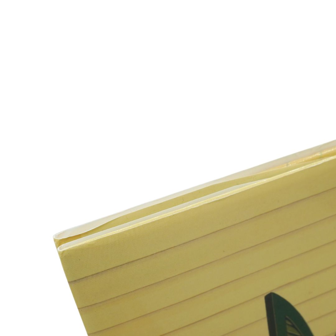 A close-up of a stack of yellow lined notepad sheets with a gold-colored edge, shown against a plain white background.