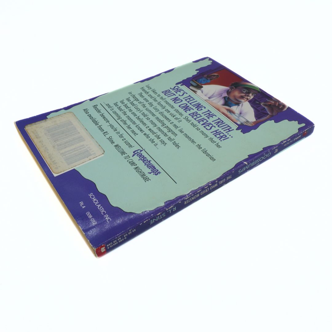 Back cover of a book with text and a small image on a white background
