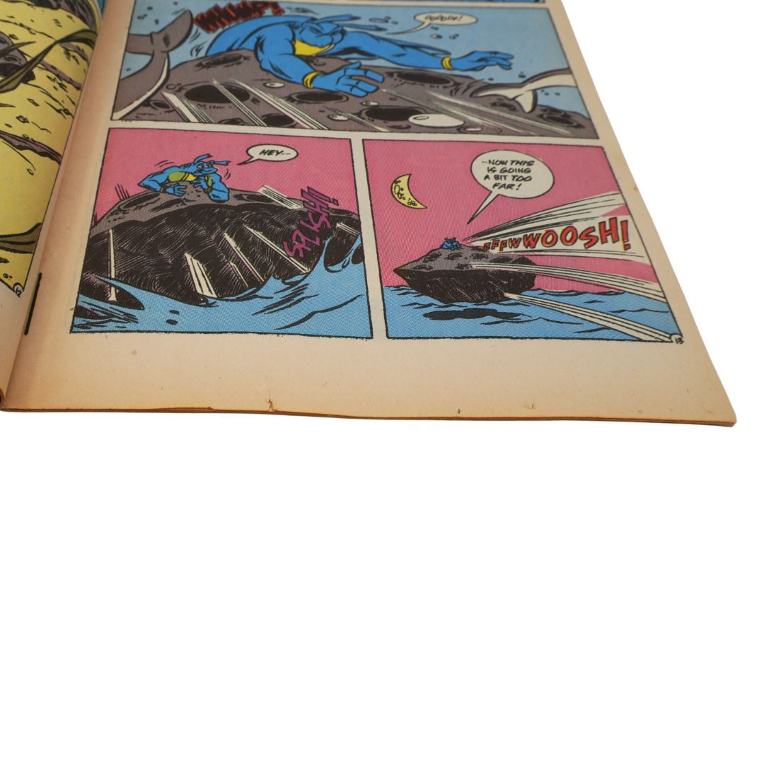 Comic book page with superhero character and ship on a white background