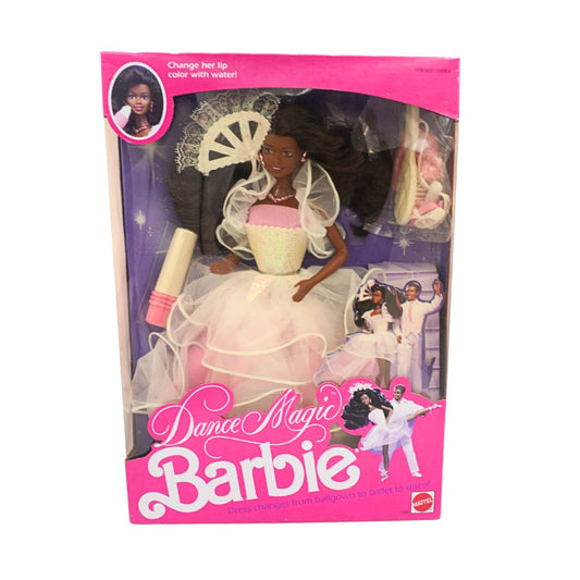 Barbie doll in white dress with packaging on a white background