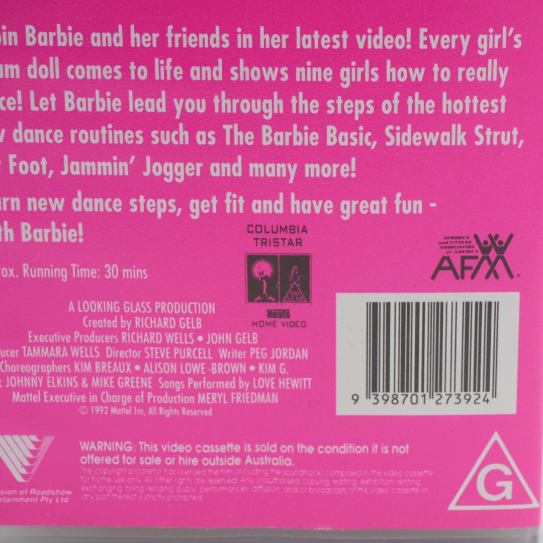 A hot pink cover of a VHS for Dance! Workout With Barbie, featuring Barbie in a star themed workout outfit