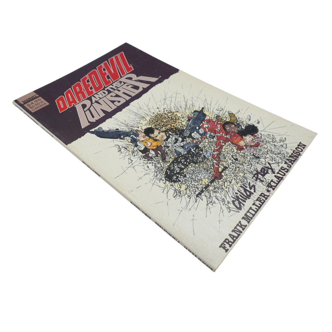 A comic book titled 'Daredevil and the Ringster' photographed at an angle on a plain white background. The cover features a dark purple masthead area with red and white title text, and a cream-colored lower section with a detailed action illustration in black, red, blue, and yellow tones.