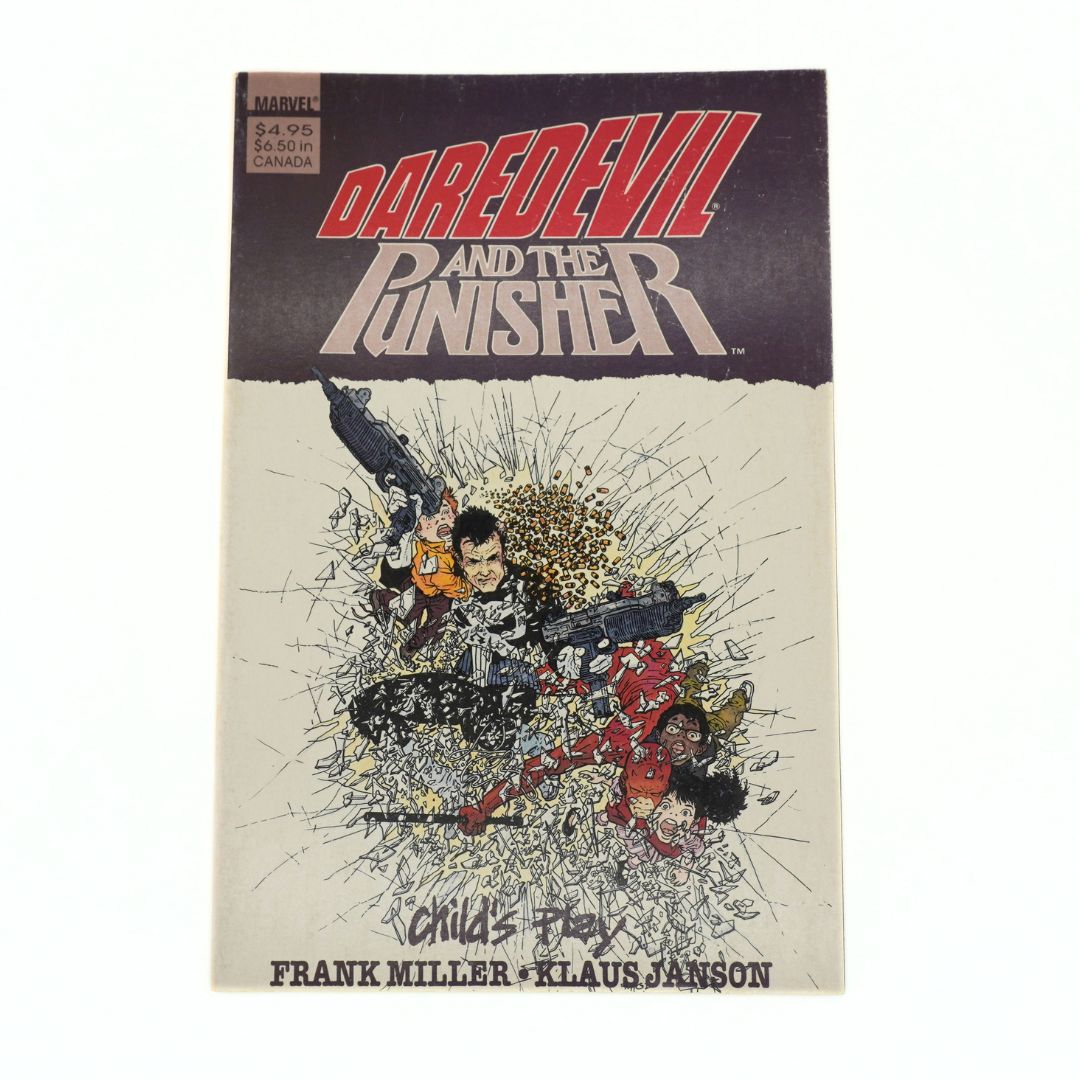 A comic book titled 'Daredevil and the Punisher' featuring a dark purple top section with bold red and white title text, and a cream-colored lower section with illustrated action art and the names Frank Miller and Klaus Janson at the bottom.