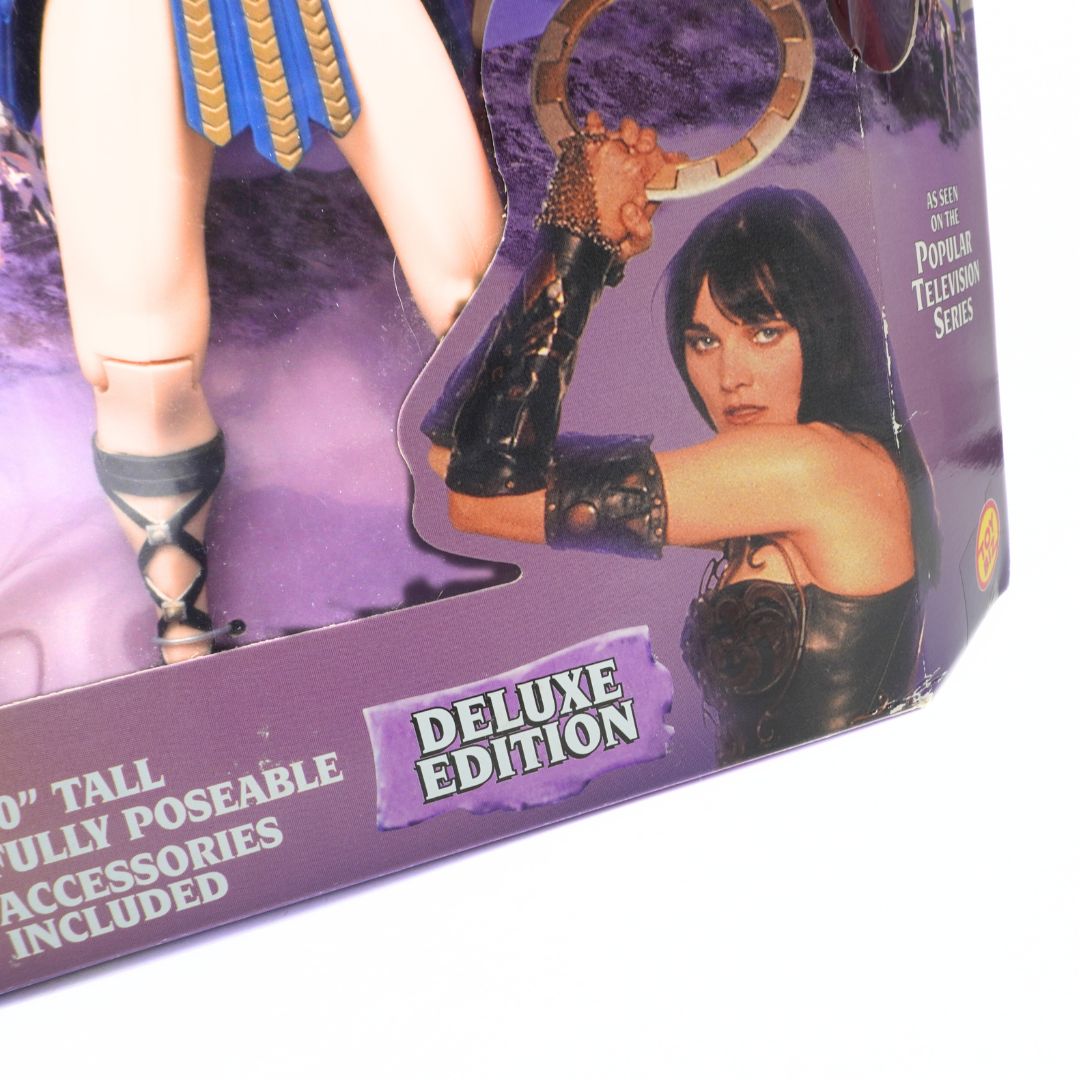 Xena deluxe edition boxed action figure with Lucy Lawless on the box