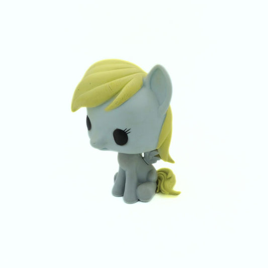 Small toy figure of a gray pony with yellow hair on a white background