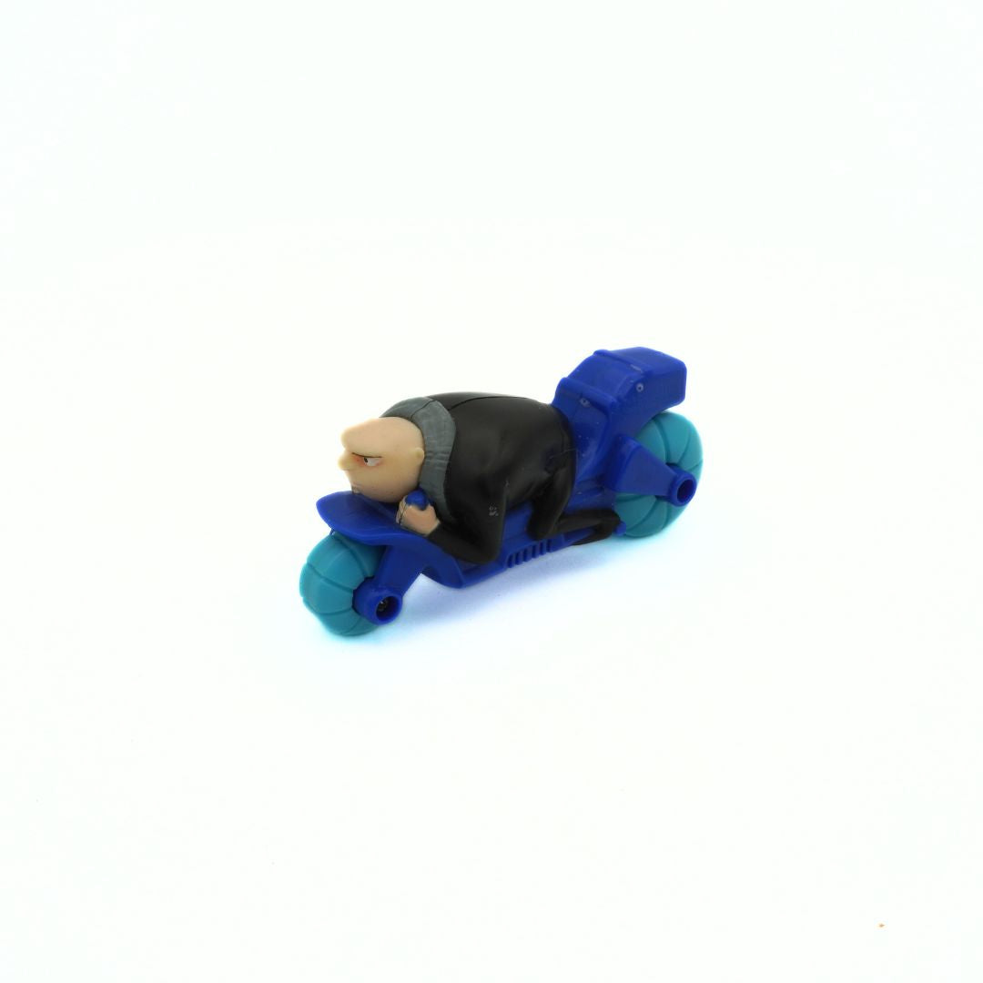 Toy figure of a character riding a blue scooter on a white background
